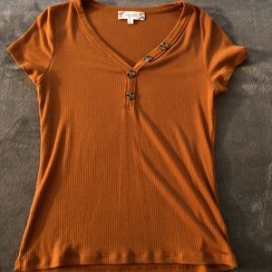 Dull orange/yellow top w/cute brown buttons